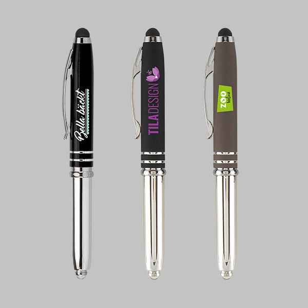 Kugelschreiber mit Licht auf grauem Hintergrund