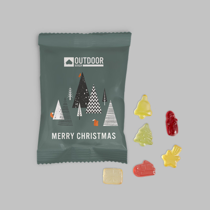 Individuell gestaltete Fruchtgummi-Verpackung vor grauem Hintergrund