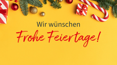 Gelber Hintergrund mit Zuckerstangen, Christbaumkugeln und Reisig &quot;Frohe Feiertage&quot; in roter Schrift