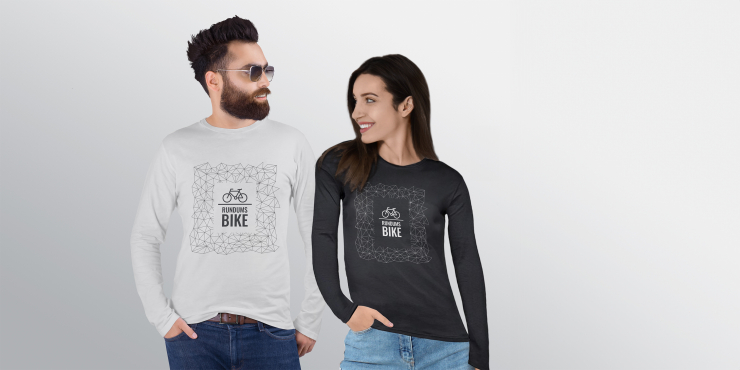  Individuell bedruckte Tee Jays® Interlock Unisex graue und schwarze langarm Shirts an Mann und Frau vor Wand